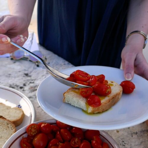 slice of bread with oil and tomatoes offered during the olive oil tasting