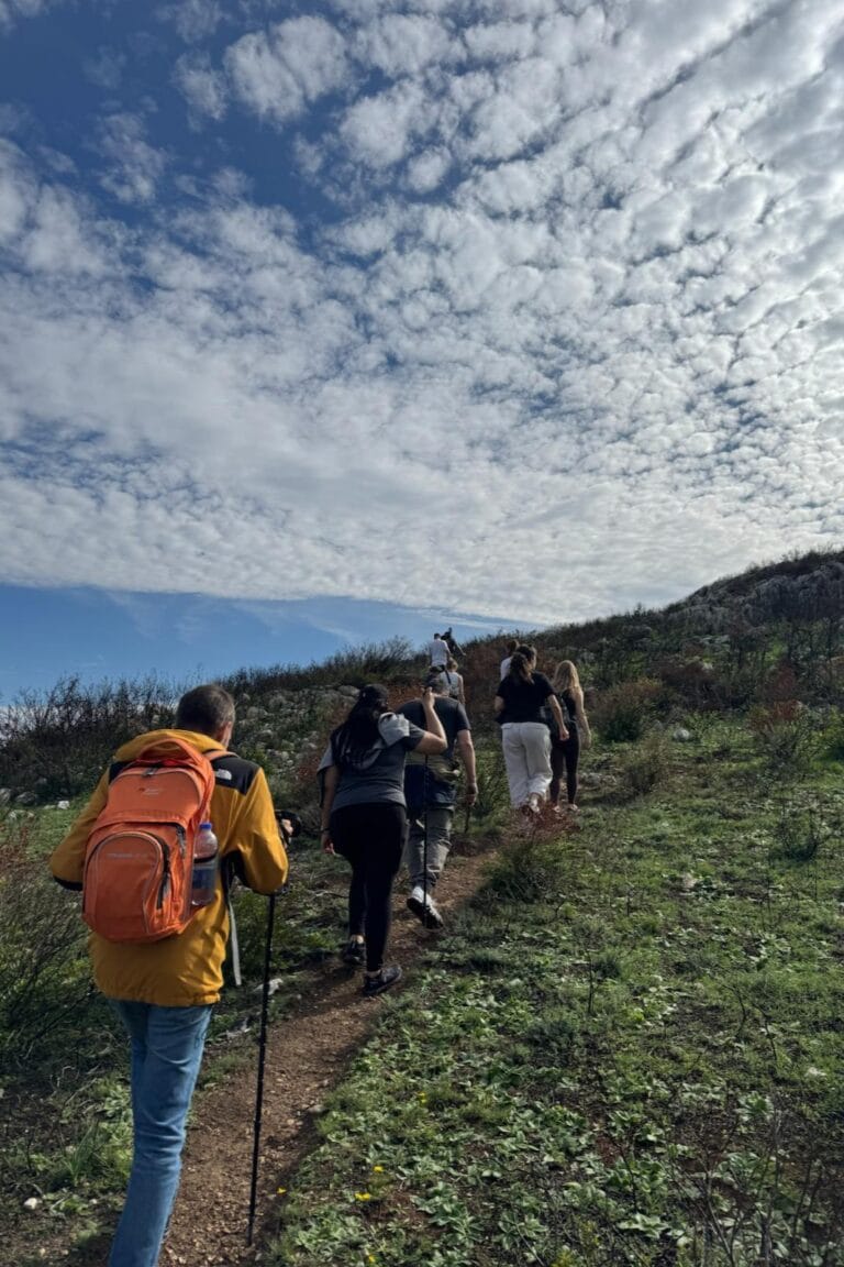 Small group hiking on a scenic trail in the Tuscan countryside