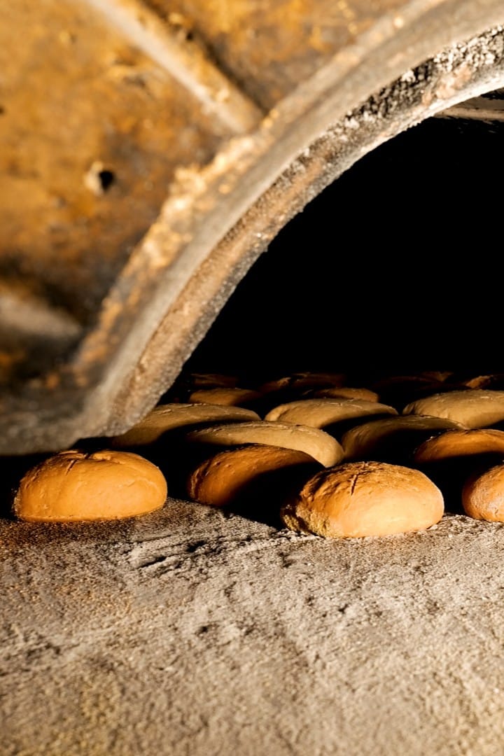 Marocca bread baking inside a traditional stone oven