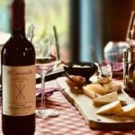 Elegant table with local wine, artisanal cheeses and traditional preserves