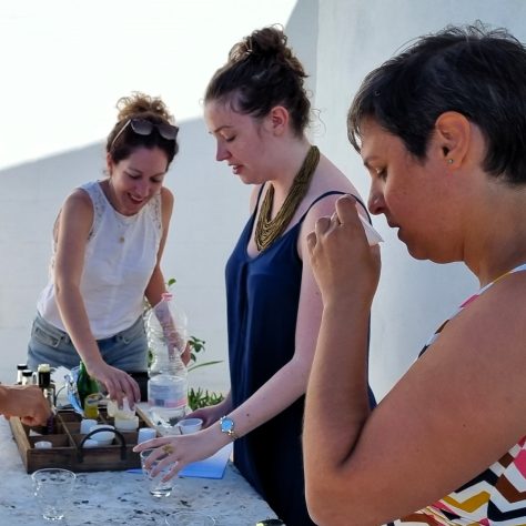 girl smelling oil during olive oil tasting